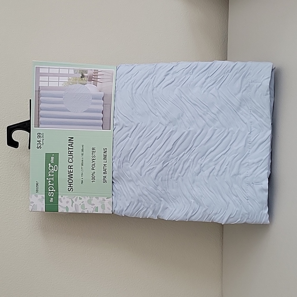 Brand new blue shower curtain.